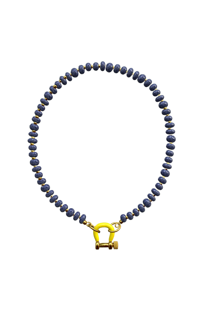 A beaded necklace made of small dark blue-gray beads with tiny gold flecks, featuring a bright yellow clasp on a plain white background.